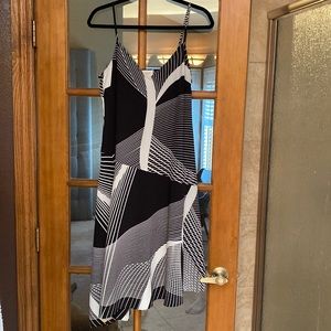 Asymmetrical black and white spaghetti strap dress